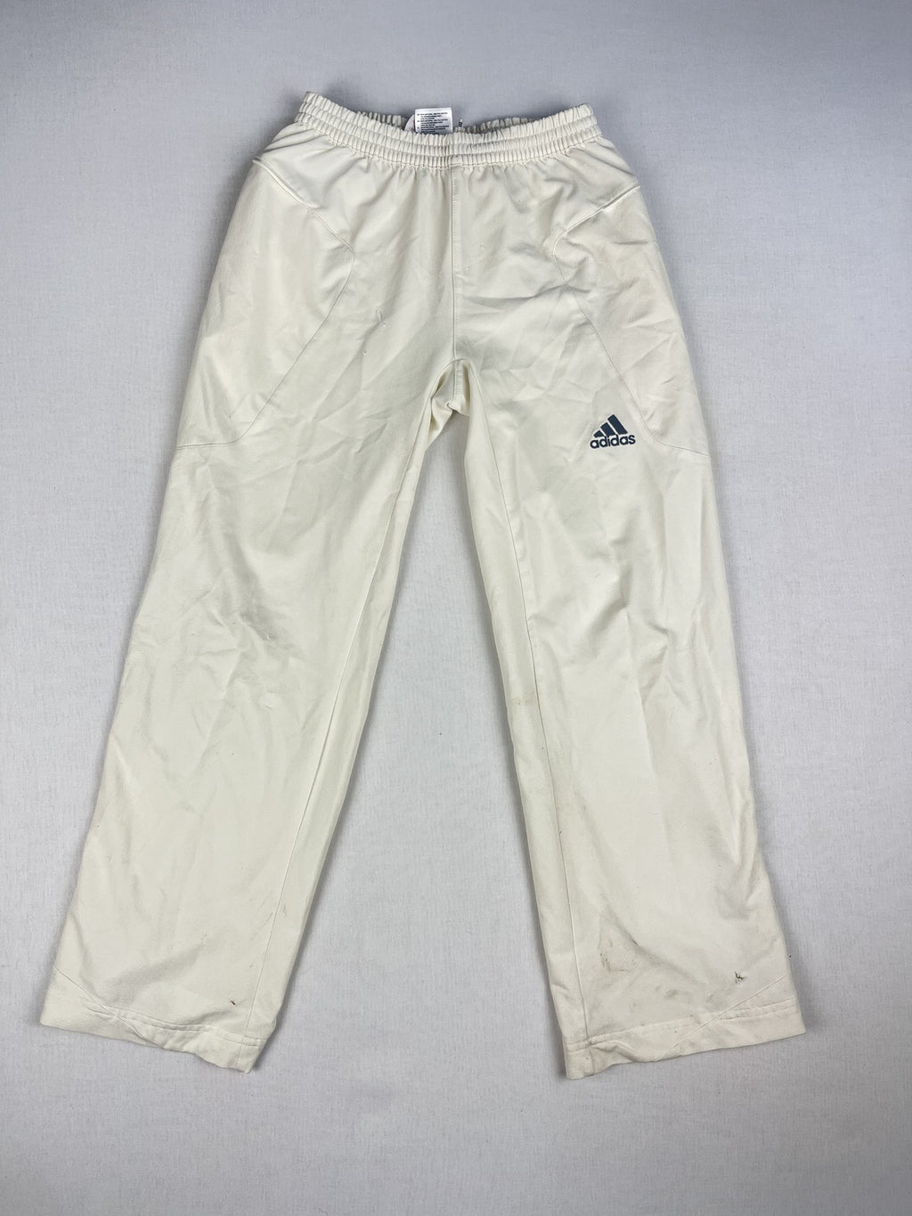 Adidas junior cricket trousers, front