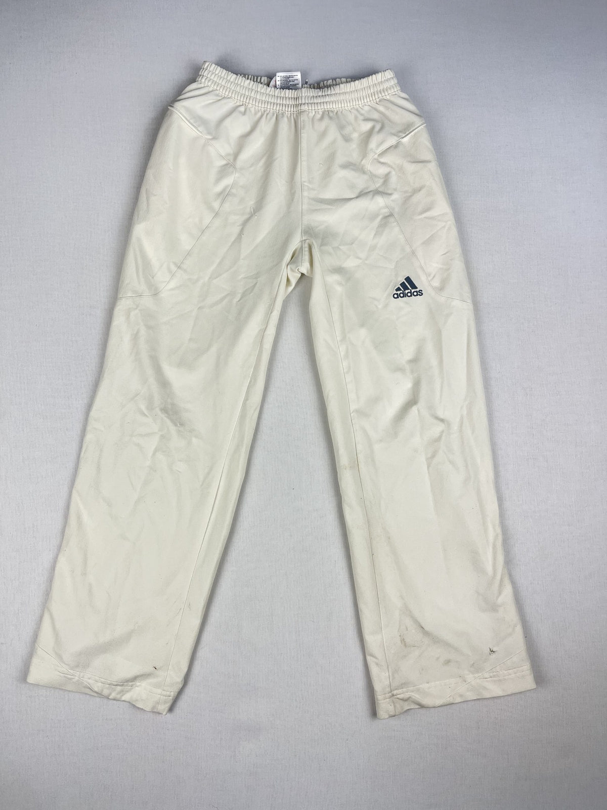Adidas junior cricket trousers, front