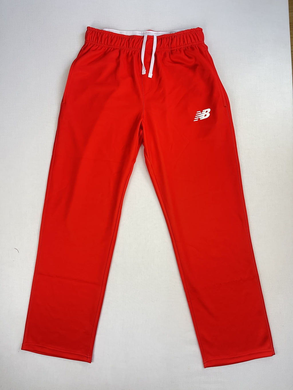 Welsh Fire New Balance red cricket trousers, front